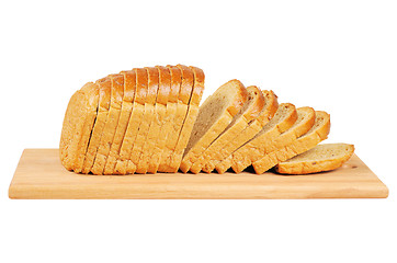 Image showing Sliced bread on wooden board.