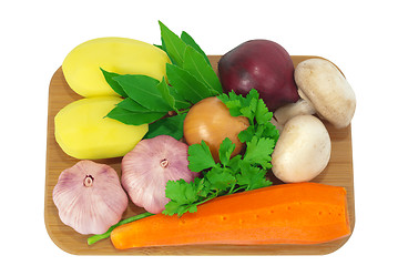 Image showing Board with potatoes, garlic, carrots, mushrooms