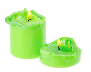 Image showing Two large green lighted candle