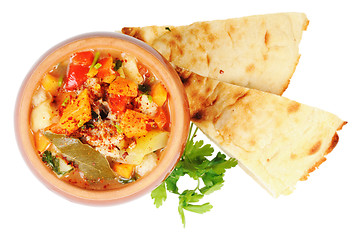 Image showing Roast in a pot and pita bread