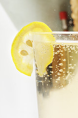 Image showing Glass goblet with sparkling lemonade and lemon