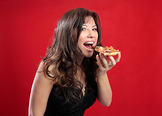Image showing Happy woman eating pizza