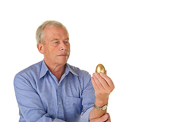 Image showing Senior man with golden egg