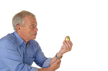 Image showing Senior man with golden egg