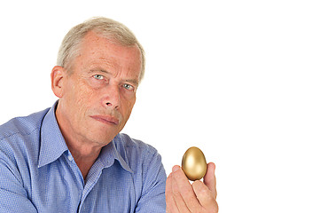 Image showing Senior man with golden egg