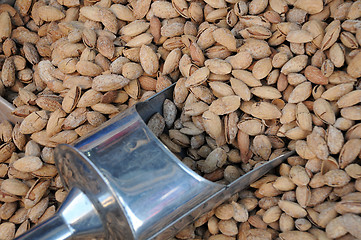 Image showing Unshelled Almonds and Metal Scoop