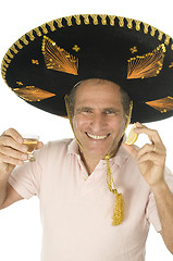 Image showing middle age senior tourist male wearing Mexican somebrero hat dri