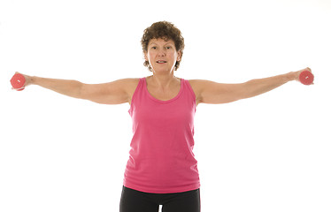 Image showing senior middle age woman exercising with dumbbells 