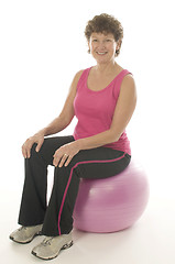 Image showing woman exercising core training fitness ball