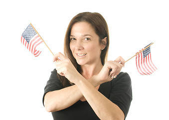 Image showing happy woman waving patriotic American flags