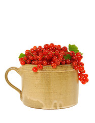 Image showing Ceramic cup full of fresh red currant berries. Clipping path included