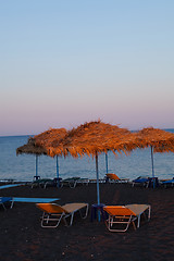 Image showing Sunbeds in Perissa, Santorini, Greece