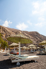 Image showing Sunbeds in Perissa, Santorini, Greece