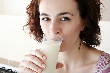 Image showing Young people eating milk with cereals