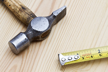 Image showing Old hammer and tape measure