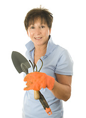 Image showing cute middle age woman garden hand tools