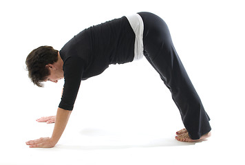 Image showing female yoga position downward facing dog pose