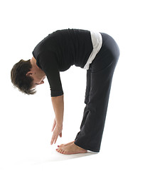 Image showing female yoga position toe touch hamstring stretch