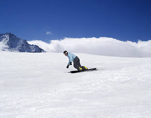 Image showing Snowboarding in mountains