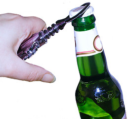 Image showing opening a bottle of lager