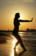 Image showing Sunset Tai Chi on a beach