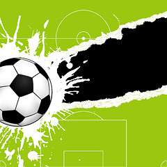 Image showing Soccer ball on torn paper
