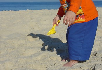 Image showing Kid playing on the beach