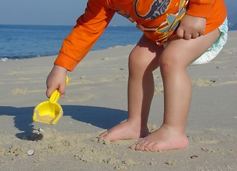 Image showing Kid playing on the beach