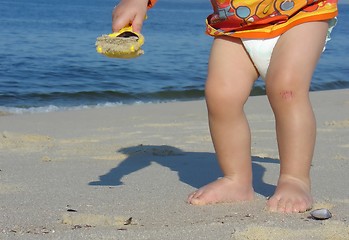 Image showing Kid playing on the beach