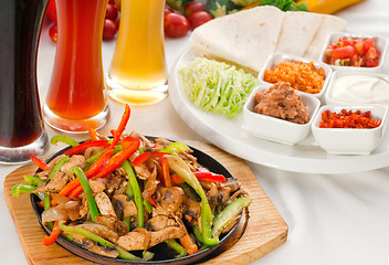 Image showing original fajita sizzling hot  on iron plate