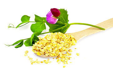 Image showing Pea flakes in a spoon with a flower