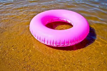 Image showing Pink lifebuoy in the water