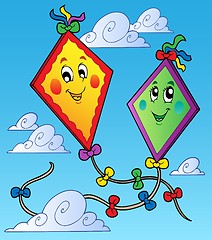 Image showing Two flying kites on blue sky