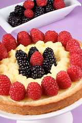 Image showing Custard tart with raspberries and blackberries