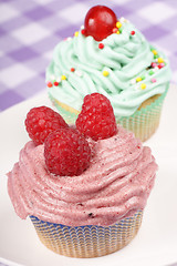 Image showing Two fancy cupcakes