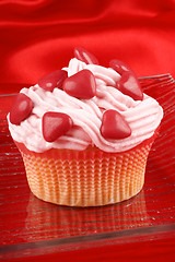 Image showing Cupcake with red sugar-coated hearts