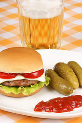 Image showing Mini cheese burger, beer and pickles