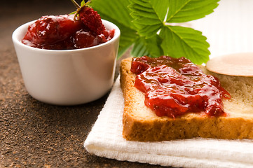 Image showing Wild strawberry jam with toast