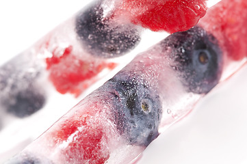 Image showing Raspberry and blackberry frozen in ice sticks