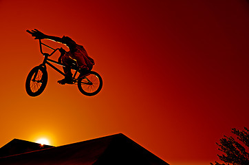 Image showing Bmx rider at jump