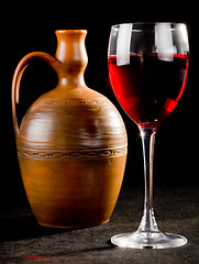 Image showing Pitcher and a glass of red liquid 