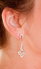 Image showing diamond earring is very close