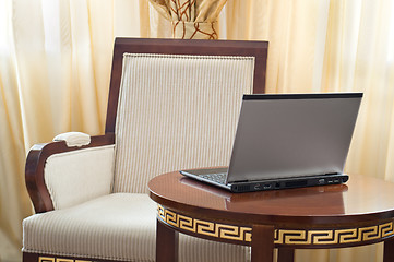 Image showing notebook (laptop) on a  home interior