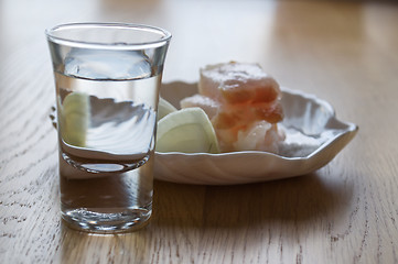 Image showing glass with vodka and a small dish of lard and onions