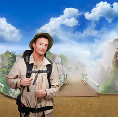 Image showing young  tourist on wooden bridge 