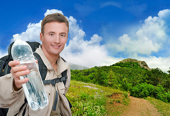 Image showing young man dressed in a tourist 