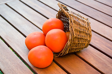 Image showing straw basket full of  tomatoes