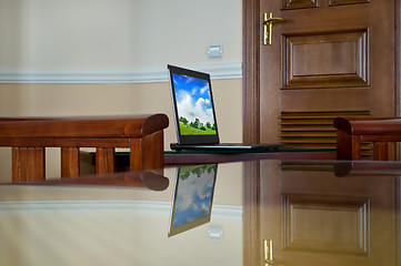 Image showing notebook (laptop) on a  home interior