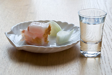 Image showing glass with vodka and a small dish of lard and onions