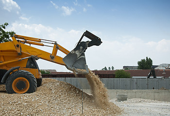 Image showing Excavator unload gravel